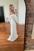 I love this dress so much! I wore it for our elopement and it was everything I wanted. I wore dark brown cowboy boots with it and he wore dark jeans, blazer, vest and a cowboy hat. The top part was a tad big and I pulled it up/adjusted several times but overall it fit very comfortably. The dress is excellent quality, with the exception of the zipper- be very gentle with it because it's hard to zip/down. But the lace top is to die for! I chose those one over 6 or 7 other Lulus dresses (but had many close seconds!). Absolutely recommend it for your wedding! - Mandy S.