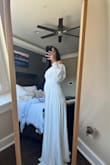 I love this dress and fits beautifully! I actually had a bump and it still fit! It's a bit long but I'm on the shorter end. - Jeel B.