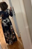 At first I ordered small because I usually wear a size 6. I mailed that back and got the medium. Much better. The fabric is WOW. 
It is a flattering style. The navy is the color I purchased. The wedding will be in NYC and it will be windy and chilly so I am wearing a black clingy v neck shirt and back leggings underneath. I hate being cold. - Paula M.