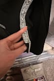I was so excited for this dress! It fit perfectly when I tried it on and couldn't wait for an occasion to wear it out! Didn't notice this when I tried it on at all! When I was ready to wear it out, I put it on and saw that the silver glitter trim in the back was falling off!!! Looks like someone didn't put enough on so glued on a small extra section to make it look like the trim was complete! So frustrated because it cannot be returned. Waste of money. - Kristen B.