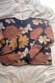 I love the embellishments of this sweater. It is so cute, and I wear it all the time. I have a feeling this will be an easy piece to incorporate year-round. Looks cute layered over skirts and dresses, shorts, or jeans (despite being labeled as 'lounge').  Be sure to wash before wearing, I found the fabric a bit itchy at first. - Meghan F.