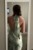 This dress is beautiful! The front is simple and the back is absolutely gorgeous. The material looks great in person. Slit is a little high but the dress is great. - Emily M.