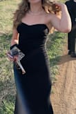 Overall, it was a stunning look, but there were some flaws. Based on reviews, I ordered a size down (xs) in this dress. I could barely get it zipped. I hoped the smaller size would help with the scrunching of the detail in the back of the dress mentioned in other reviews. However, it's still scrunched up. Additionally, the boning in the front of the dress was so sharp it was poking through the top! I had to open up the seam and cut away some of the sharp boning. - Kamron W.
