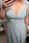 Nice material, really really cute dress - not the fit I wanted. In the pics, you can see how at the bottom of the dress the buttons fit well, but as you go up my ribs and my bust, the buttons get further apart. You can see the stretch more, and the material underneath it. I don't think it looks bad, but personally, I feel like I'd like it consistent all the way up. Along with the stretching buttons, I had loose fabric in the back even with tightened straps. I think that if you're anywhere near my bust size, be wary of how the buttons might look! I really do love this dress but I'm returning it because I'm going with another dress I ordered from here!! Great dress but not for my bust! - Sirena W.