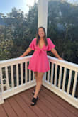 I love this dress! I bought it for a bachelorette party. The one thing I'll say is it is a little short for my normal liking. I ended up wearing bike shorts underneath because the smallest bend or wind revealed my undies! - Emily C.