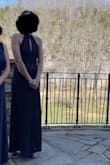 I removed the bow from the back. Came off cleanly. I'm wearing 3.5" wedges. No hem needed. Fit like a glove, but had some stretch space left if I needed it. - Helen K.