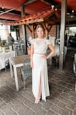 This was a beautiful dress! I got so many compliments on it. I wanted something a little different for my shower and this was perfect. It did run a little big - I probably could've gotten away with an XS but kept the small & got it altered. Absolutely loved it. - Danielle I.