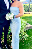 We had it taken in a little on the bust area and the waist. The pearl beading and sequins really made this dress stand out. - Jen O.