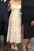 I had gotten this dress for my small courthouse wedding and I absolutely LOVED it. The price was fair, the size was perfect, and I didn't NEED heels for it to fit my length. With me being short that's usually the case, but it didn't hit the floor even without my heels on. I also love that it didn't accentuate my lack of boobs, so it still looked flattering for those in the IBTC. I adore this dress! - Gillian G.