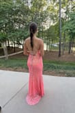 I bought this for my daughter to wear to prom.  She received so many compliments.  It is absolutely gorgeous in person and true to size.  The color is goes very well with a pretty tan. - April A.