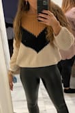 Chunky, loose cable knit sweater that you can dress up or down. Very comfortable and looks just as pictured on the site. Still wearing it in fall and winter 2 years later. :-) - Christel H.