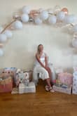 I wore this dress to my bridal shower and got tons of compliments. It was comfortable and a stretchy material. I washed it in a mesh bag and the pearls stayed on. Great quality! I got a size medium - Jenna