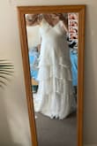 I loved this dress! It fits very well in the bust area. Personally, it is a little too lowcut for my taste, but I love the material! It is a very nice, simple dress for my wedding. - Irene M.