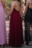 This dress is gorgeous. It was a little big in the chest area for me, and I had to have it sewn up a bit; I had the bottom hemmed too. The back is beautiful! - Learsi A.