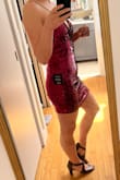 The dress is very pretty and has a nice fit. It was a little hard to get on (can't step into it because narrow at the hips, feels like you're going to lose some sequins while pulling it over your head), but comfy once it's on. It sheds a ton of little black fibers. - Veronica B.