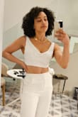 I thought I'd be a medium in the top but it was really big on me. The small was MUCH better for me. Fabric is beautiful. Cut is very flattering and the straps are big enough to hide bra straps and the back strap as well. - Courtne O.