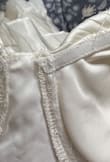 I had such high hopes for this! The color overall was too off-white, closer to a light yellow and the construction was a mess. The seams were messy/sticking out and the pleats were crooked throughout. - Lydia N.