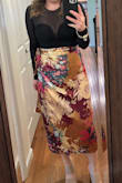 I LOVED this skirt. I purchased a large and probably should have gotten a medium. I was grateful for the slightly extra amount of length as this is a true wrap skirt. The material is very light and very prone to a wardrobe mishap with the slightest breeze. However, the skirt was super comfy, looked great, and I received a lot of compliments! Would totally recommend. - Sara B.