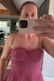 The straps are sewn into into two different areas of the top, and are not symmetrical. - Leeann G.