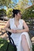 It runs a bit lose but I was comfortable. Initially I purchased a Large but exchanged it right away for a MEDIUM. The medium fits a little lose but it works. I think a small would have been too snug in the bust area. - Emigdia M.