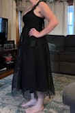 From the picture online, I thought I'd love it but nope. I bought a small, and it was still too big. Honestly, I don't think an XS would have made a difference. As the other reviews say, the straps are not adjustable either and the dress creates nothing for your figure. Also, I found it very long. I'm 5'7 and this is just a strange length. - Cailyn B.
