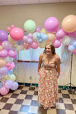 I loved this dress and got so many compliments! I did have to pin the chest together because the button kept coming undone and it was a little tight but not uncomfortable. It does have a pretty high slit but overall it was a perfect dress for my wedding shower! - Samantha W.