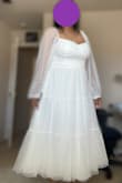 It fit beautifully but ran a little large in the bust and shoulders, as the sleeves kept falling off. I think it would be fine with a thicker strapless bra and safety pins. Otherwise, it is a beautiful dress and very flowy. I love that I can twirl in it. - Ilisa P.