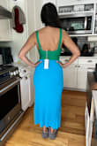 Feel like a million bucks in this dress. It's soft and flattering and the colors are so vibrant. The cutout is tasteful and the best part is you can wear a regular bra without an issue. It's perfect for spring because of the sweater material and also for summer because of the light colors and because it's sleeveless. Go for it!!! - Marline K.
