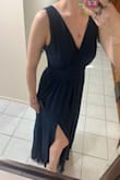 The material is super nice; it's very heavy. It might actually be too warm for a Memorial Day wedding. The length was absolutely perfect. I'm 5'10 and won't need to shorten the length at all. I got a medium and it fits great. The only place I'll need to take it in a smidge is the armpit area. The slit wasn't as high as other reviews made it seem. - Olivia L.