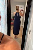 I ordered two rounds of dresses. Kept two dresses from first batch then a month later had a change of heart and ordered 5 more. This navy dress had the look I wanted for a spring wedding guest in Colorado. When it arrived the leg slit hung wrinkly so I took to a seamstress and she explained it was sewn wrong. I called Lulus customer service. They were great. Accepted all my returns and reshipped me a new navy dress with a perfectly sewn slit.  This is my first time using Lulus and I will return. The dress is a classic cut and length for my 54yo body to feel comfortable and attractive. Really like the halter style top and sexy leg slit. - Stacy H.