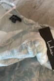 I was really excited about this purchase but as soon as I opened it I saw that I received a ripped dress, it has three areas that are ripped. One in the front left side near the breast area
Another on the back by the armpit and one on the top right breast area. I am Rey upset because my event is in 2 weeks and I dont know if that's enough time to replace it. Beyond frustrating - Elizabeth T.