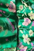 I bought this dress to wear to a Kentucky Derby party. I received many compliments on the dress. It is a gorgeous shade of green with pretty fuchsia accents. However, after having it on for about 3 hours, I noticed it was pulling apart at the seams. I could not get home fast enough! Also, the rubber around the top of the dress kept folding over. I was tugging at the dress the entire event. I was really hoping to wear this again, but unfortunately have wasted my money. - Erica P.
