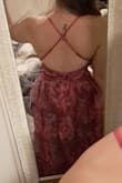 Beautiful and bright color! Sexy, but not too much, dress cut. It has a hot pink/magenta underlayer with a cool purple floral organza layer. Does run small around the midsection and has no give. I'm usually small across the board but went up to a medium, and it fits perfectly around my lower rib cage. Thin adjustable straps are nice. Bust is a little looser. I need to steam the organza flatter so it's not so poofy in the bust. I also stitched the cleavage area up a little for more support since it's loose for me. The photo shows after I stitched it up. Otherwise, it's a deeper V cut. I'm 5'2" so I knew I'd have to hem it. So excited to wear it for two weddings this year! Yes, I am wearing this dress to multiple weddings. I love it so much, and it's versatile for the seasons. I may throw on a blazer or shrug if it's chilly. Would recommend if you don't mind doing some modifications. - Teresa S.