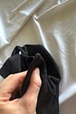 The v part of the shirt is a metal wire. I washed the shirt once and the metal wire (on both sides) popped out. It's pretty cheap looking in person. I would've returned it but the return window closed. Not great quality. I do not recommend. - Jilan W.