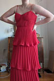 I really like this dress. The material is nice and flowy so when you are dancing or walking it swishes around and looks good. It also is good for the heat since it's airy. The dress is pretty true to size, and was a little stretchy. It ends mid-calf on the model since they are super tall, but for me was right at ankle length. The only downside was the terrible zipper which is a hallmark of all the dresses I have gotten from Lulu's, which gets stuck at the waist seam and is a pain to open or close. I will probably have to fix it at some point. - Casey N.