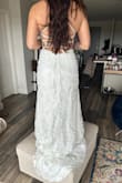 I LOVE this dress! I'm usually between a 4 or 6. I ordered dresses from Azazie and was a 4, but I am a solid 6 with Lulus... the dress fits like a glove. Do yourself a favor and have someone help you tie the back. The straps aren't silk so they don't pull easily and it can be tiring to try and get it to fit right without help. Pics don't do this dress justice. The beading is gorgeous, and the dress is super flattering on. It was the overall winner as my wedding dress! - Trisha N.