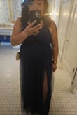 I loved this dress and received so many compliments on it. The neckline is very low so I had to find a special low cut bra for my cleavage to look nice. Ended up wearing a bra with clear straps for extra push up power. I also had the center of the dress hemmed together to make it more modest. There are TWO very high leg slits which is sexy and beautiful when you walk. The sheer fabric over your legs make it not as revealing. However, I was out on a windy day and it was difficult to keep from flashing everyone my panties. It was also difficult to walk up and down stairs because it's hard to gather up the bottom of the dress with the two openings for your legs. Hard to explain. Other than all that, I felt beautiful and can't wait to wear it again! - Michelle L.
