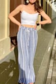 Love the style and feel of the top. Fits well. The fabric does really pill with friction, though, so it will stop looking really clean and out-together after a few wears.

Attached photos without and with bra. - Veronica B.