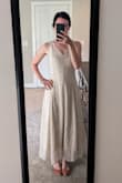 Ordered a Small.
This dress fits me so well. As other reviews say, it doesn't have any stretch so the bodice is very fitted. I ordered this dress for a summer wedding and figured I'd need to make some adjustments since I am petite. The shoulder straps were just a bit long for my frame so I had them trimmed and re-sewn. This helped bring the bodice up a bit too.
Love the back. I shopped around to find the right bra/shapewear. I recommend finding a lightweight bodysuit with a low back and built-in bra.
I'm excited to wear this! - Ruthie H.