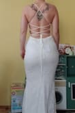 I am from Finland, measuring 168cm and about 75kg, pear-shaped. This dress hugs me like a glove. Size L is just perfect, the top area can be sized right with the straps and the hip area fits perfectly since the fabric has a lot of elasticity.
Quality is fine, some dangling threads but I can cut them before the event. I will anyway take the dress to be modified since I don't want it to be that long. - Minna K.