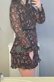 So overall this dress is adorable. However, it runs extremely small. I normally wear a large but had read reviews and decided to order an XL and am glad I did. The body of the dress zipped perfectly with the XL, but the sleeves were still incredibly small. I loved the design of the dress so much that even though the sleeves were super small, I still decided to wear it to my graduation and one of the sleeves ripped before I even got out the door of the house. - Corie M.