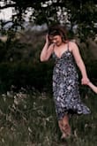 The dress is pretty and unique. It was a bit tight on me; I'm usually a medium and ordered a small. It ended up being more low-cut than I'd have liked and didn't flatter me in the chest area. The fabric is very thin and sheer. For photos, it was cute, but I don't know that I'll ever wear it again, hones - Brianna C.