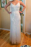 This dress didn't have many reviews and I ordered it along 5 others. It was just perfect! It has a little stretch to it, it shines beautifully and it moves very comfortably. It is a little on the heavier side, and the straps do seem a tad weak - I've read other people say they've gotten them reinforced and I am considering the same. But aside from that, it just worked out. The length is perfect for my height and the back looks just amazing. - Mariann P.