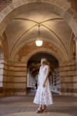 This dress was exactly what I was looking for - an elegant, but cute dress for my PhD graduation! I was looking for a long, white dress that was a little bit more sophisticated than your typical grad dress. I love the open back and how adjustable the dress is due to the ties. It is everything I was looking for! - Madison D.