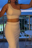 I usually don't like wearing white, but this dress was perfect! Material is thick so it holds everything in place and doesn't show any imperfections.  Simply perfect! I got a lot of compliments! Definitely recommend.  I bought size SM because I like a tight fit. I'm glad I did because it's just right.  I want to order other colors. - Yessica O.
