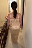 This dress fits like a glove!  I am wearing it as a bridesmaid dress in my brother's wedding, as the bride wanted to have texture.  I am so excited to wear this.  I am typically a size small and ordered a size small.  It is so flattering on, lays beautifully in all of the right places, and has flexible fabric.  The length is perfect.  I am 5'1" and will not need to get the length altered for once.  The material photographs beautifully.  I can't wait to dance in it as it has such fun movement. - Rachel K.