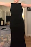 This dress fit like an absolute glove. I'm 5'2" and was able to wear 2" heels, it hit the ground at a perfect length. I would say if you're a taller than 5'2", it would be like it is on the model(mid shin). The fabric is very comfortable but definitely well made. - Kendall K.