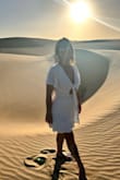 The dress is made of thread, soft white, it does not blind the eye, it is not transparent. It was perfect for my vacation in the desert. - Daymara E.
