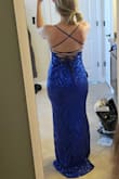 This dress is great! Very flattering. It is a bit short in front for me as I am 5'10". I will have to wear kitten heels or flats to make this dress work. The train is a bit annoying, but it is so pretty that I am going to keep it for the ball we have scheduled. The sequins is quite scratchy, but that is to be expected from a sequins dress. - Amanda D.