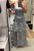 I ordered this for my niece's wedding where I'm sort of the maid of honor (no one is standing up though). The material is light and flowy with a slight shimmer. I tend to wear mediums from Lulus but needed a small for this dress. It doesn't have any stretch but definitely extra room on the medium (and I'm curvy). - Lauren D.